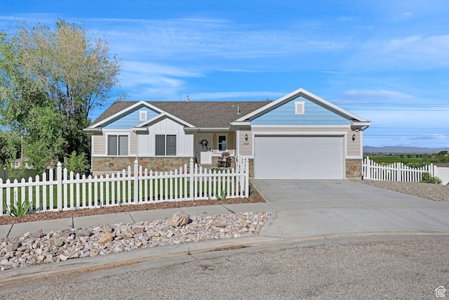 644 S 100 E, Willard, UT 84340 - single story home featuring stone siding, an attached garage, driveway, and a fenced front yard