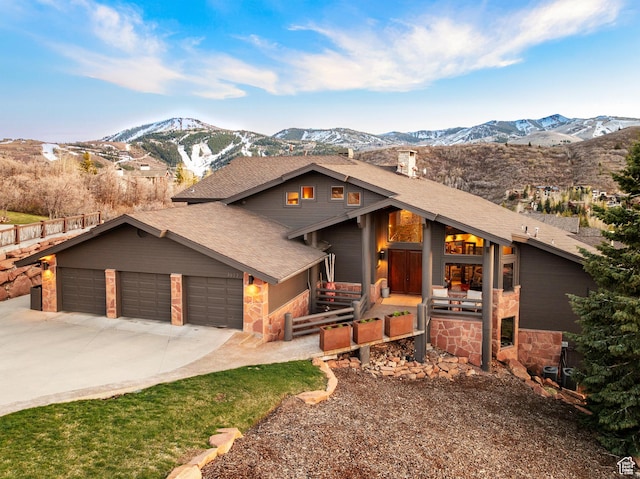 3623 Oakwood Ct, Park City, UT 84060 - view of front of property featuring a mountain view, a shingled roof, driveway, a garage, and stone siding