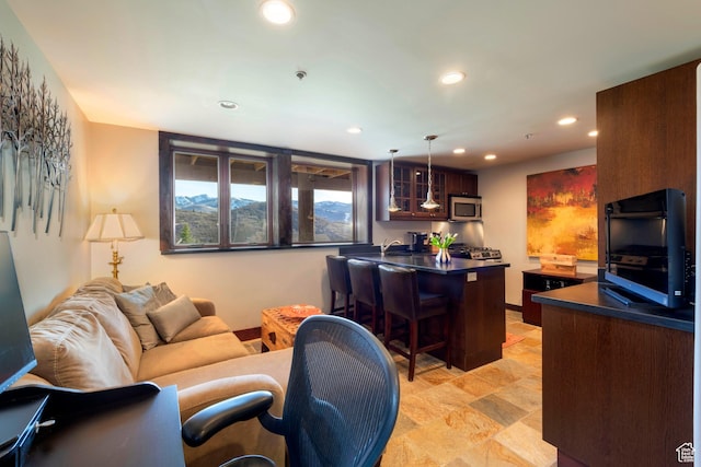 3623 Oakwood Ct, Park City, UT 84060 - living room featuring recessed lighting, light stone finish floors, and bar area