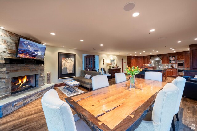 3623 Oakwood Ct, Park City, UT 84060 - dining area featuring recessed lighting, a stone fireplace, and wood finished floors