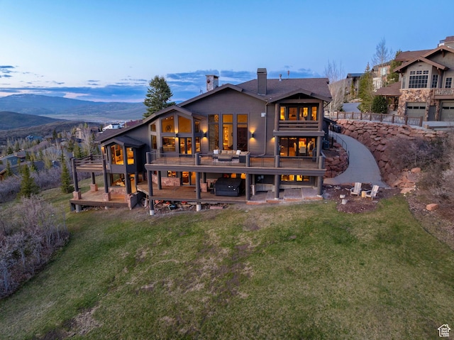 3623 Oakwood Ct, Park City, UT 84060 - back of house featuring a deck with mountain view, a yard, and a chimney