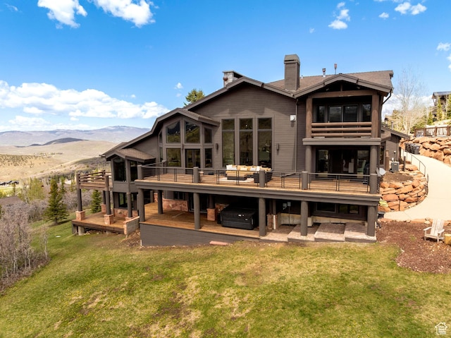 3623 Oakwood Ct, Park City, UT 84060 - rear view of house featuring a chimney, a yard, and a deck with mountain view