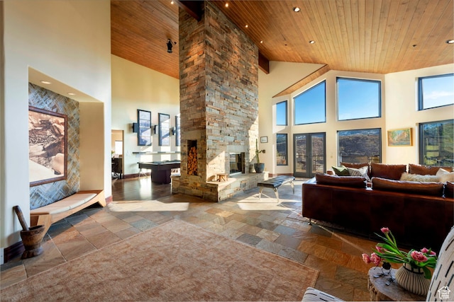 3623 Oakwood Ct, Park City, UT 84060 - living area with stone tile floors, high vaulted ceiling, wood ceiling, recessed lighting, and decorative columns