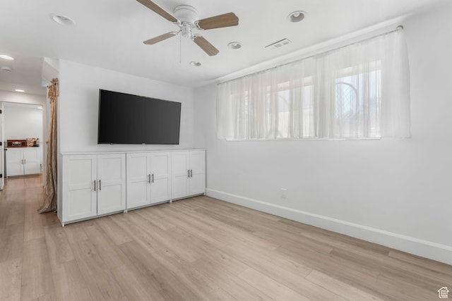 unfurnished living room with baseboards, light wood-type flooring, plenty of natural light, ceiling fan, and recessed lighting