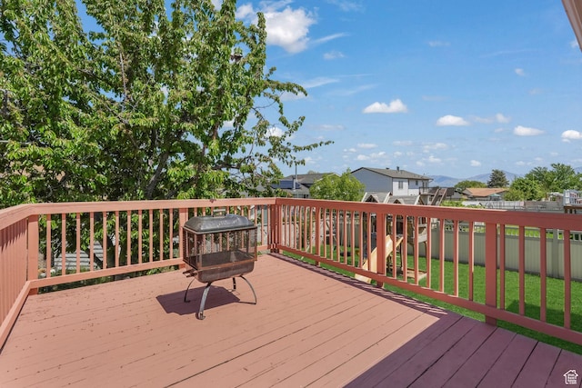 deck featuring a fenced backyard and a residential view