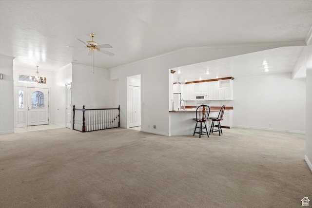 5280 S 1035 E, South Ogden, UT 84403 - living area featuring a chandelier, light colored carpet, a ceiling fan, crown molding, and baseboards