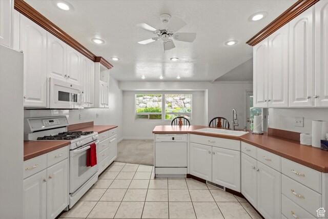 5280 S 1035 E, South Ogden, UT 84403 - kitchen with white appliances, a peninsula, a sink, ceiling fan, and recessed lighting