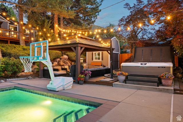 view of patio featuring a gazebo, an outdoor living space, a hot tub, and an outdoor pool