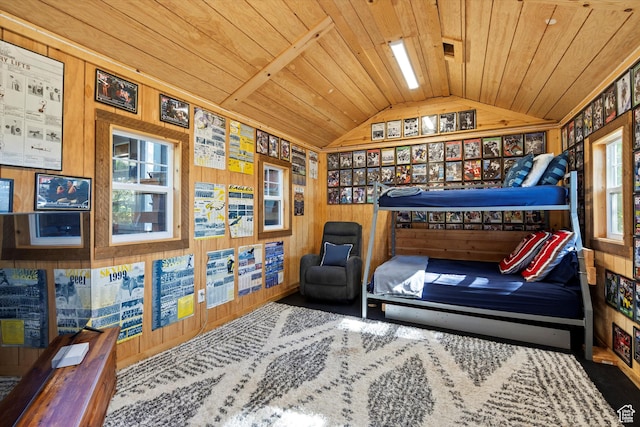 bedroom with lofted ceiling, wood ceiling, and wood walls