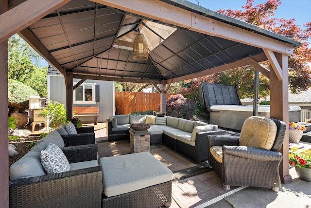 view of patio / terrace featuring a gazebo, an outdoor hangout area, and fence