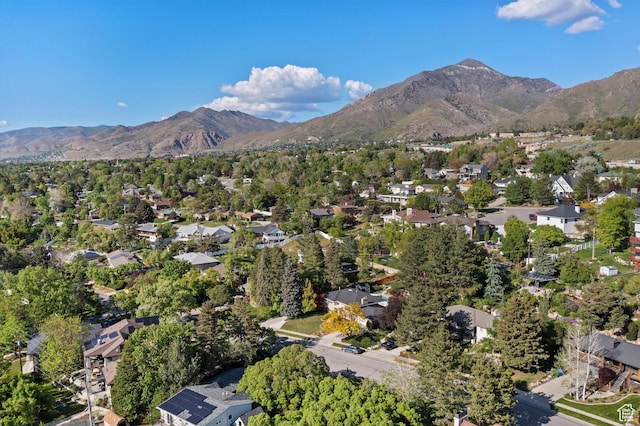 view of property location with a mountainous background and nearby suburban area