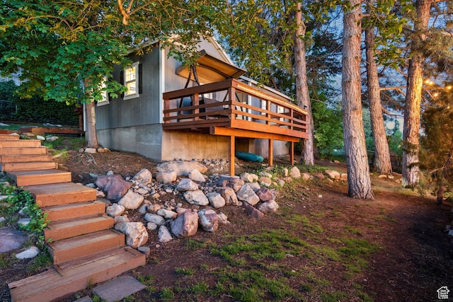 back of property with stairway and a deck