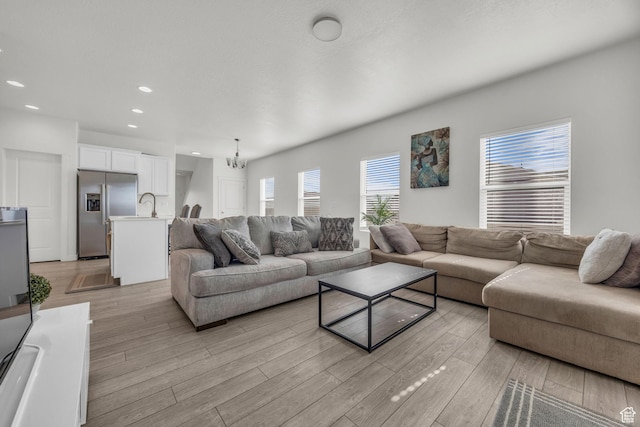 405 W Domain Ln, Grantsville, UT 84029 - living room featuring light wood-type flooring, recessed lighting, and a chandelier
