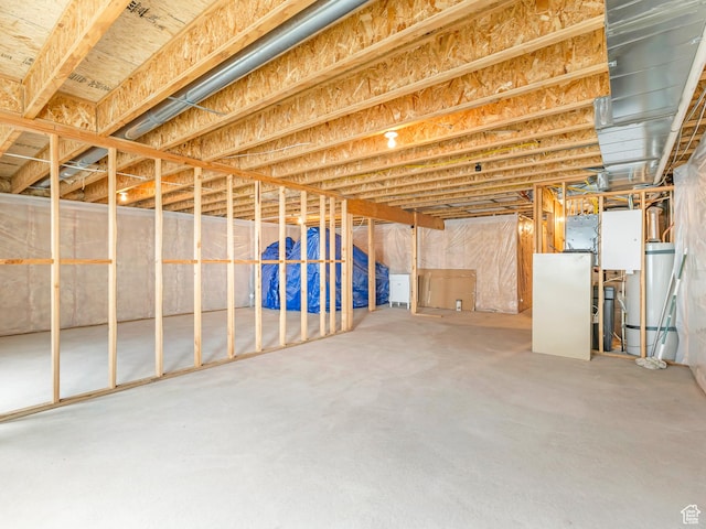 unfinished basement with water heater