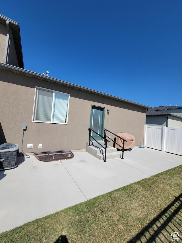 250 W 1200 S Unit 84, Tremonton, UT 84337 - back of house featuring a patio area, central AC unit, stucco siding, and fence