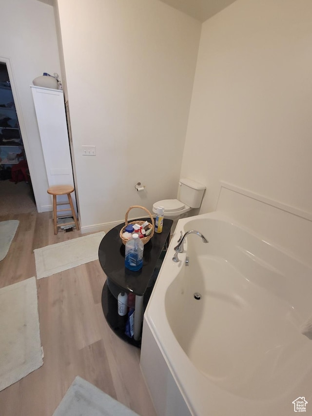 250 W 1200 S Unit 84, Tremonton, UT 84337 - bathroom featuring wood finished floors, a bath, and baseboards