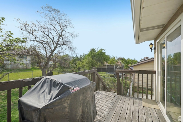 4372 S Wildrose Dr W, West Valley City, UT 84120 - wooden terrace featuring a yard and grilling area