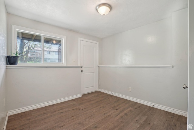 4372 S Wildrose Dr W, West Valley City, UT 84120 - spare room with wood finished floors and baseboards