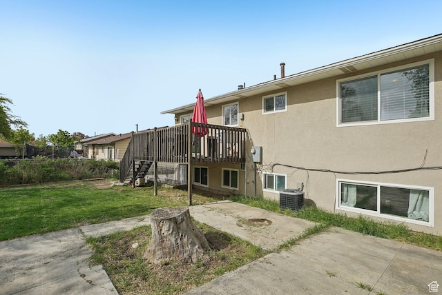 4372 S Wildrose Dr W, West Valley City, UT 84120 - back of property featuring a patio area, stucco siding, stairway, a deck, and central AC unit