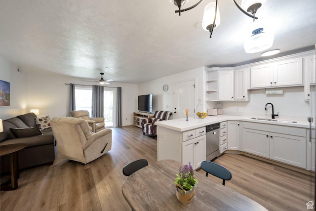 317 S 1000 W Unit 104, Pleasant Grove, UT 84062 - kitchen featuring a sink, stainless steel dishwasher, open floor plan, light wood finished floors, and open shelves