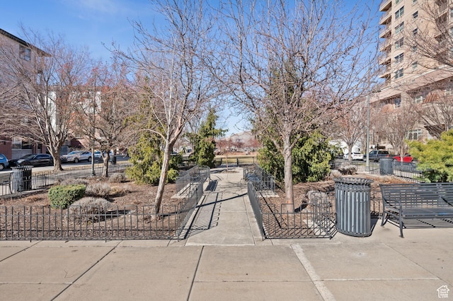 view of property's community featuring fence