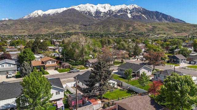 aerial view of residential area featuring mountains