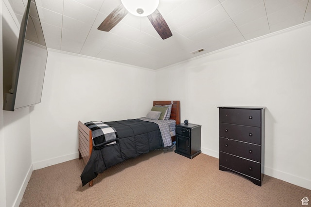 bedroom with carpet floors, baseboards, and ornamental molding