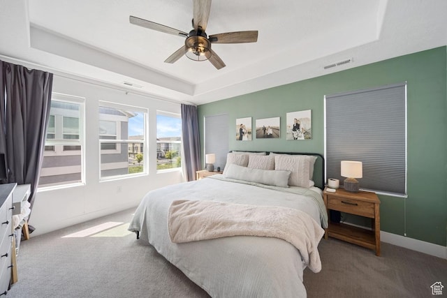 3850 W Kinglassie Ln, Taylorsville, UT 84129 - bedroom with a raised ceiling, carpet, a ceiling fan, and baseboards