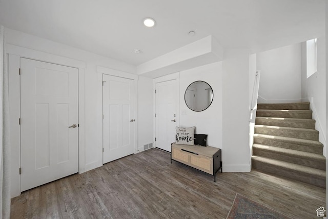 3850 W Kinglassie Ln, Taylorsville, UT 84129 - foyer featuring wood finished floors, stairway, baseboards, and recessed lighting