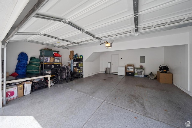 3850 W Kinglassie Ln, Taylorsville, UT 84129 - garage with a garage door opener and electric panel