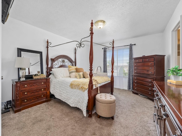 carpeted bedroom with a textured ceiling