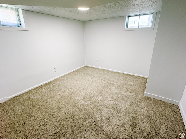 1177 W Picture Dr, Salt Lake City, UT 84116 - below grade area with carpet flooring, baseboards, and a textured ceiling