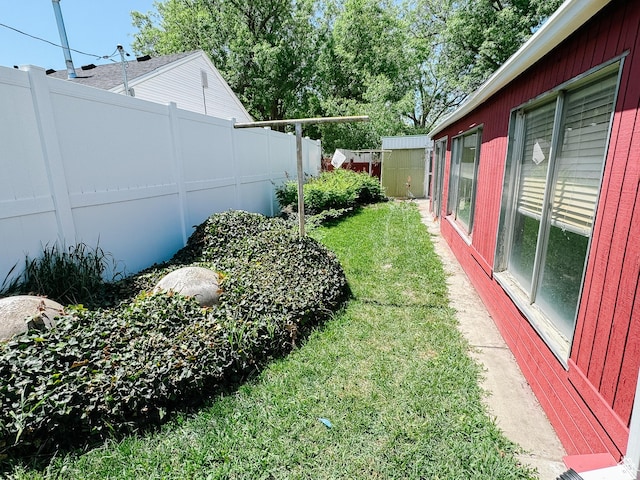 1177 W Picture Dr, Salt Lake City, UT 84116 - view of yard with a storage unit and an outbuilding