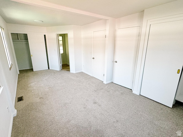 1177 W Picture Dr, Salt Lake City, UT 84116 - unfurnished bedroom featuring carpet floors and two closets