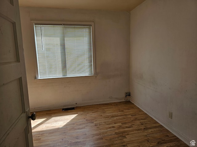 383 N 100 E, Price, UT 84501 - empty room featuring wood finished floors and plenty of natural light