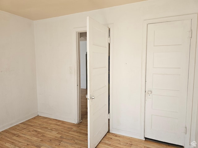 383 N 100 E, Price, UT 84501 - unfurnished bedroom with light wood finished floors and baseboards