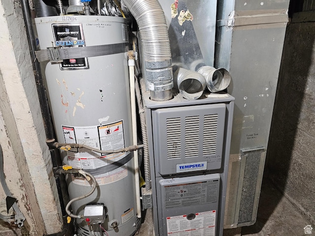 383 N 100 E, Price, UT 84501 - utility room featuring strapped water heater