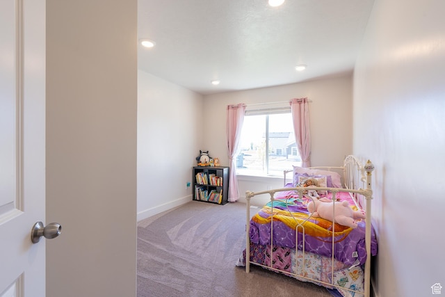 carpeted bedroom featuring recessed lighting and baseboards