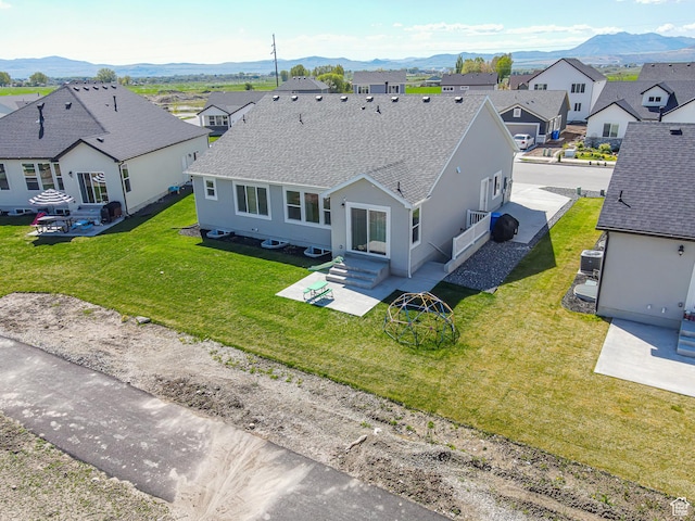 aerial perspective of suburban area featuring a mountainous background