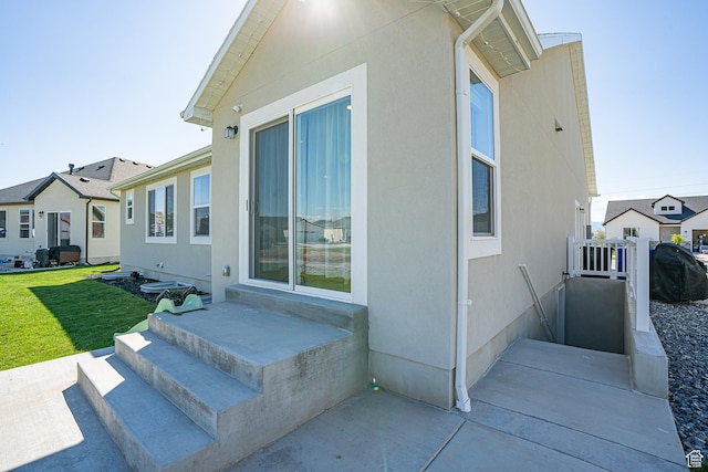 view of property exterior featuring a lawn