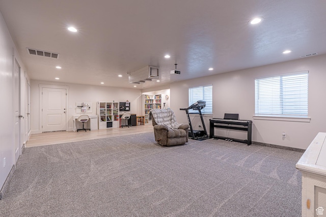sitting room featuring carpet flooring, recessed lighting, and baseboards