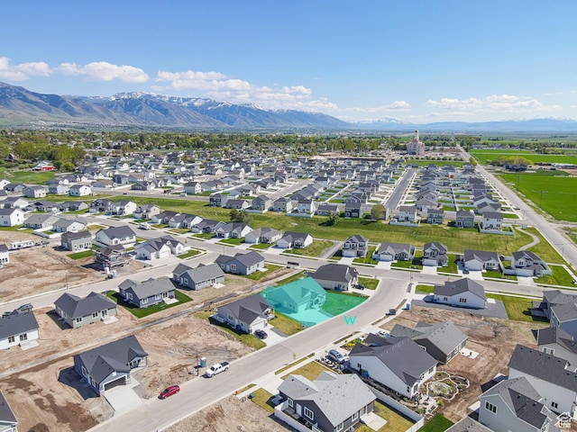 aerial view of residential area featuring mountains
