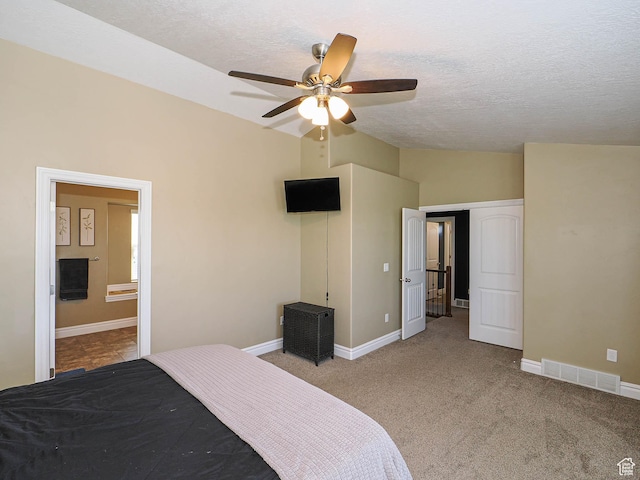 879 W Saddlebrook Dr, Kaysville, UT 84037 - bedroom with vaulted ceiling, a textured ceiling, carpet, baseboards, and ensuite bath