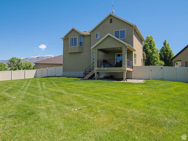 879 W Saddlebrook Dr, Kaysville, UT 84037 - back of house with a gate, stairway, and stucco siding