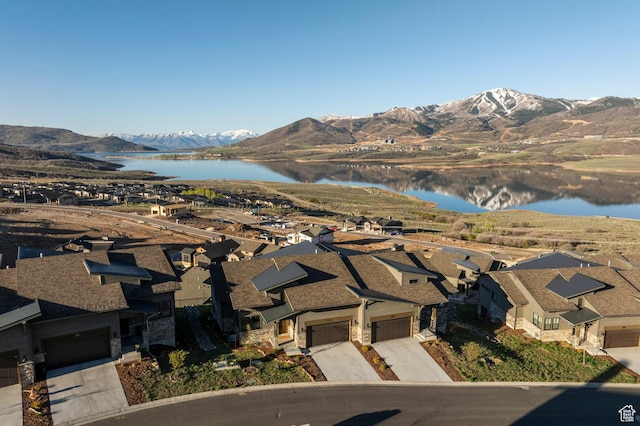 view of property location with a water and mountain view