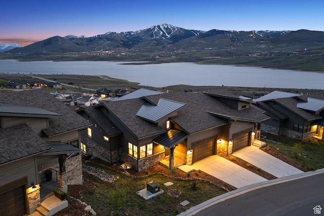 view of subject property with a water and mountain view