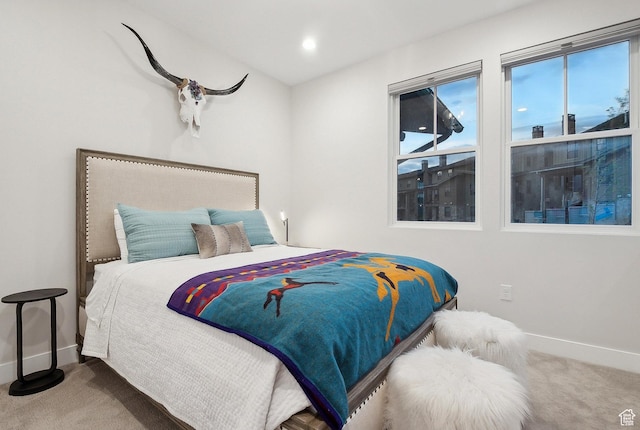 bedroom featuring carpet and baseboards