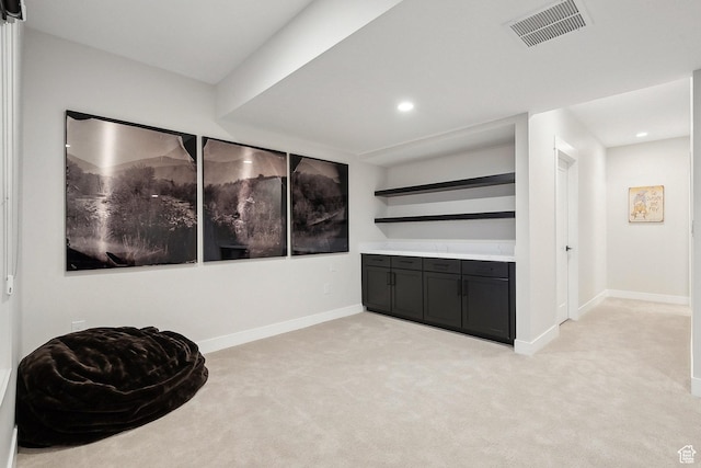 unfurnished room featuring light colored carpet, baseboards, and recessed lighting