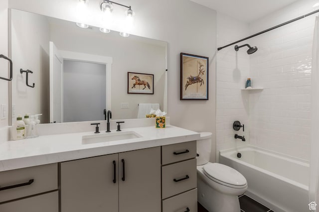 bathroom with toilet, vanity, and shower / tub combination