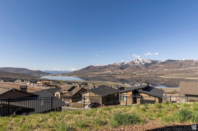 view of mountain background featuring a large body of water